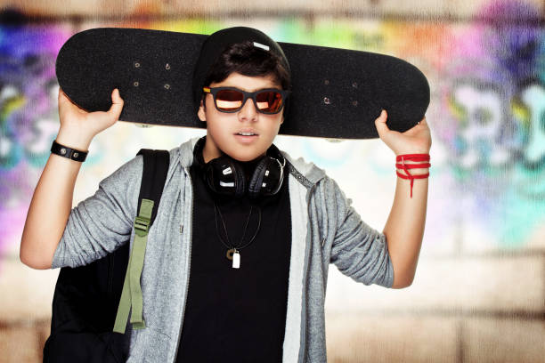 istock Stylish teen boy with skateboard 836494932