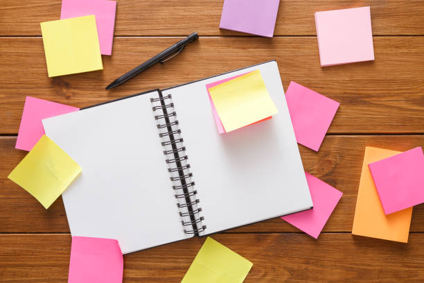 istock Top view of blank notepad on wooden office desk 836498910