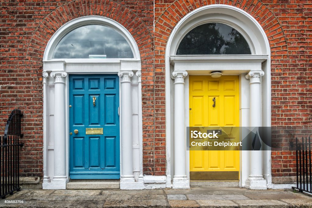 Blue and yellow classic doors in Dublin, example of georgian typical architecture of Dublin, Ireland Two Objects Stock Photo