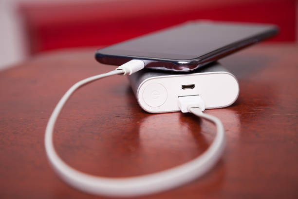 istock Mobile Phone Charging With Power Bank and USB cord 836502782