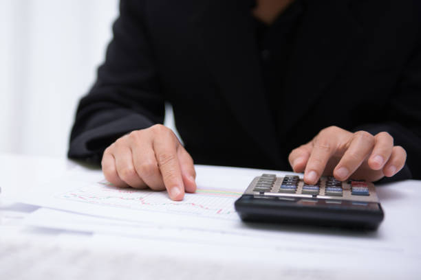 istock Business woman working with financial documents in office. Analyzing financial data, helping the company's business succeed. 836508338