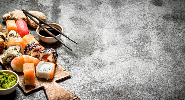 istock Japanese food. Fresh rolls with seafood and soy sauce. On rustic background. 836509300