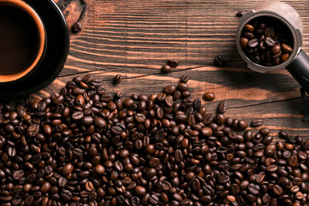 istock Coffee cup and beans frame on wooden table 836518108