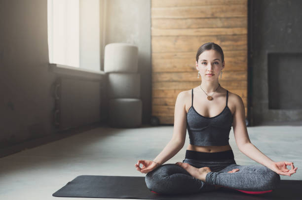 istock Young woman in yoga class, relax meditation pose 836518998