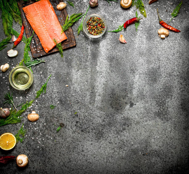 istock Raw fish. Salmon fillet with herbs and spices. On rustic background. 836523048