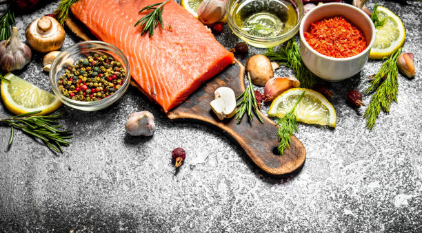 istock Raw fish. Fresh salmon fillet with herbs and spices. On rustic background. 836523816