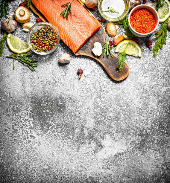 istock Raw fish. Fresh salmon fillet with herbs and spices. On rustic background. 836523836