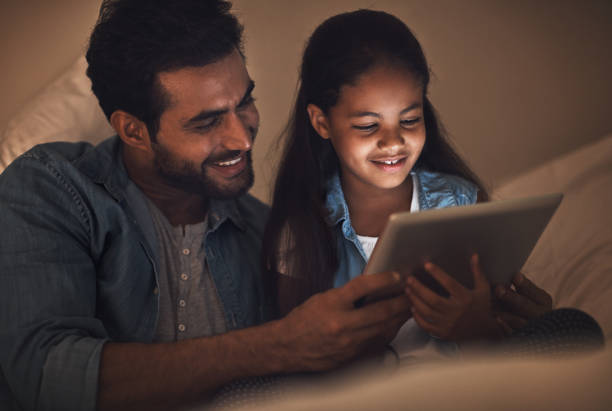 istock Winding down the day with a digital bedtime story 836523854