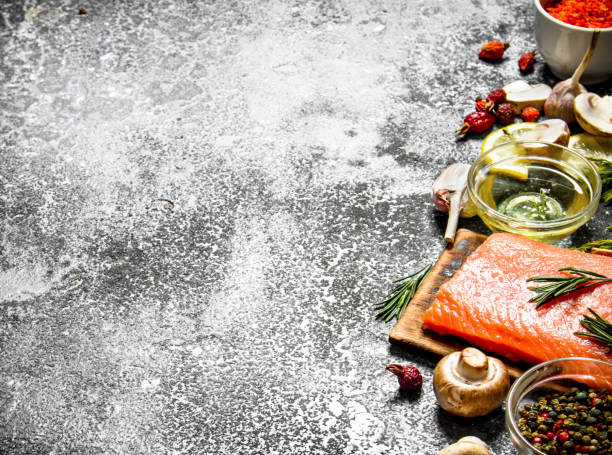 istock Raw fish. Fresh salmon fillet with herbs and spices. On rustic background. 836523856
