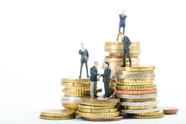 istock Finance team ,stack of money businessman model standing 836526512