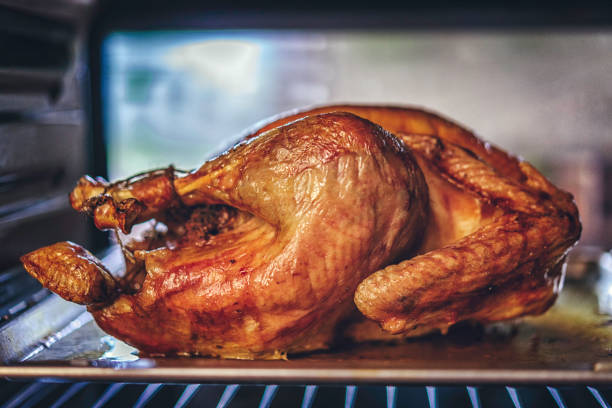 istock Turkey Roasting in the Oven 836531594