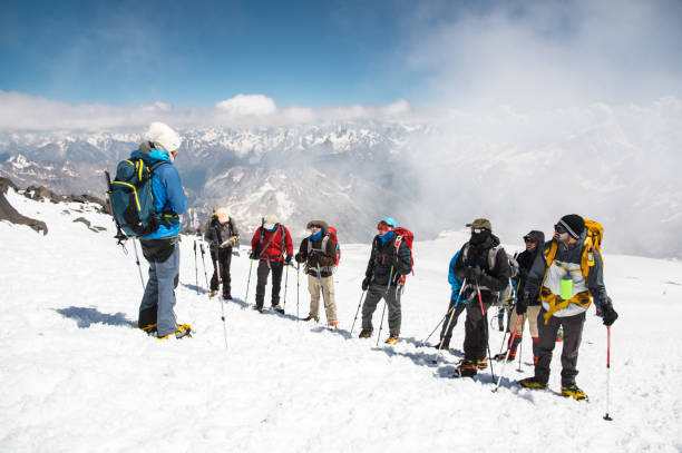 istock A team of climbers led by a guide discusses the upcoming ascent 836535320