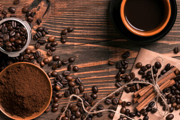 istock Coffee beans, ground coffee and cup of brewed coffee on rustic w 836538966