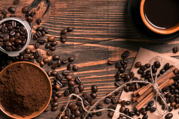 istock Coffee beans, ground coffee and cup of brewed coffee on rustic w 836539052