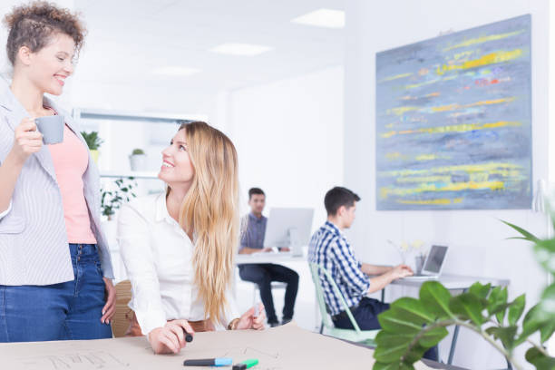 istock Female colleagues talking in office 836539764