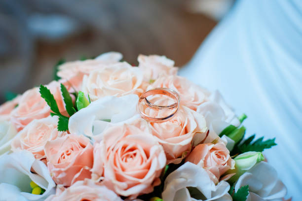 istock Wedding rings and bouquet 836540272
