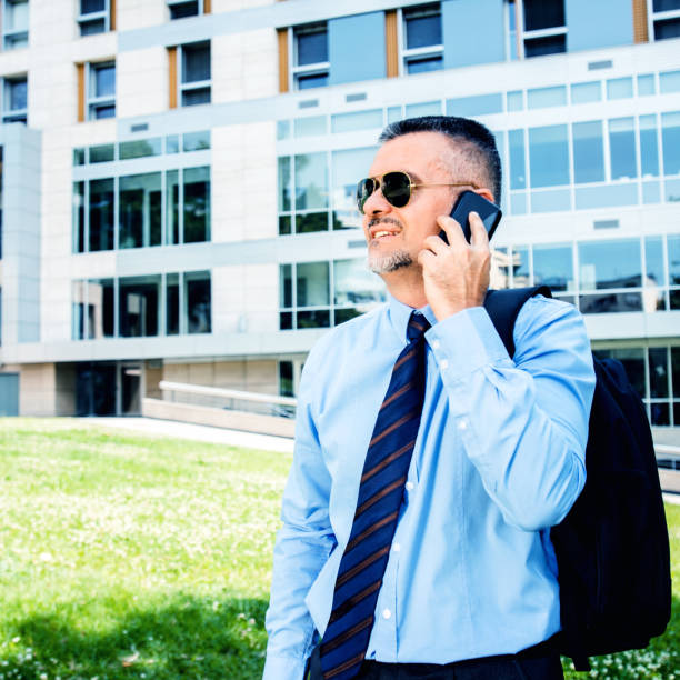 istock Businessman talking on mobile phone 836540348