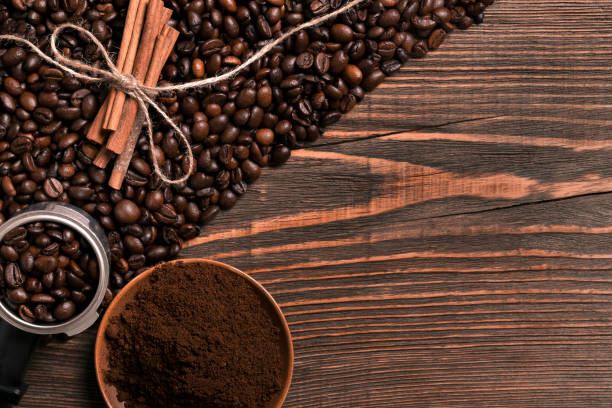 istock Coffee beans, cinnamon sticks and ground coffee on rustic wooden 836542836