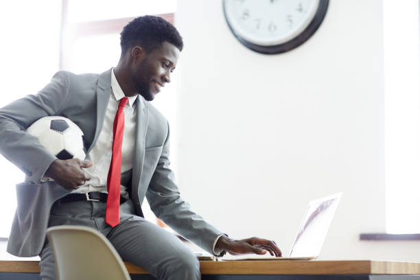 Businessman with soccer ball