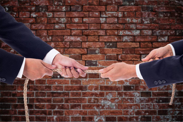 istock Tug of war business 836544584