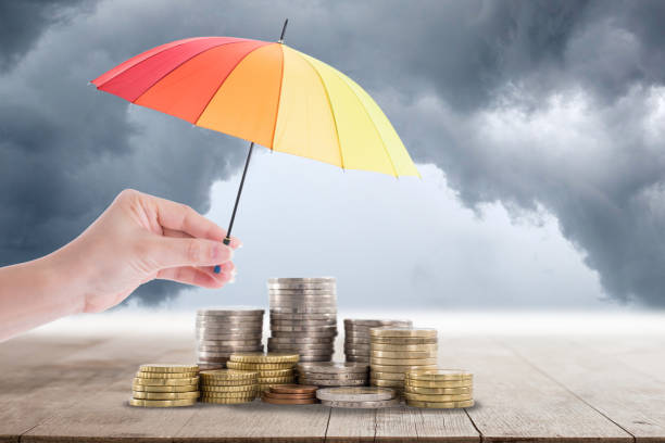 istock Holding colorful umbrella for saving money. 836548908