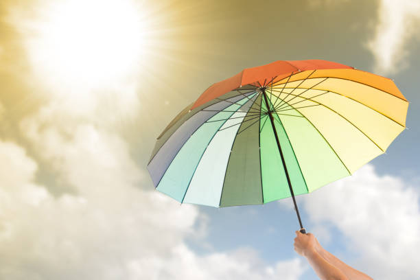 istock Holding colorful umbrella 836548946