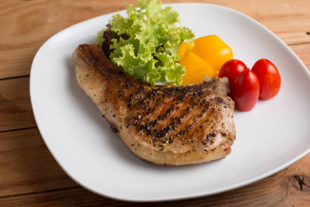 istock Grilled Pork chop prepare for serve to customer on the table. 836551578