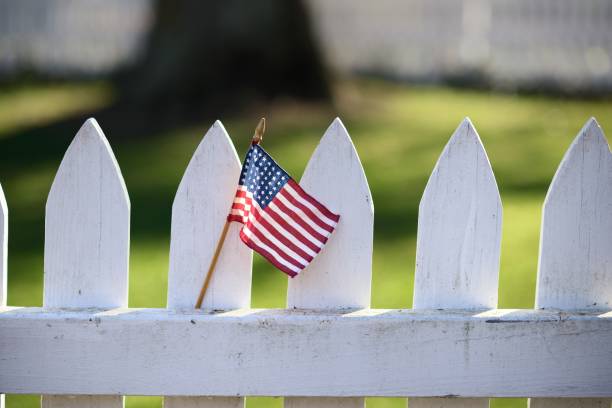 istock American Flag on White Picket Fence 836555314