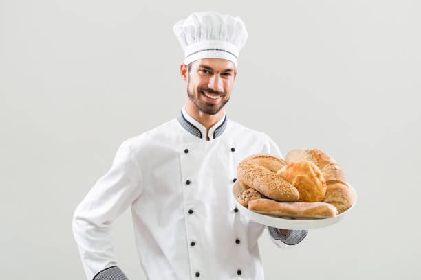 istock Baker holding bunch of bread 836555644