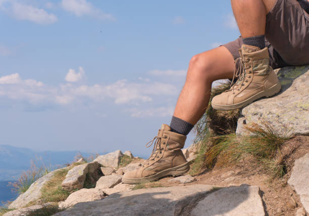 istock The guy in trekking boots. close-up 836558550
