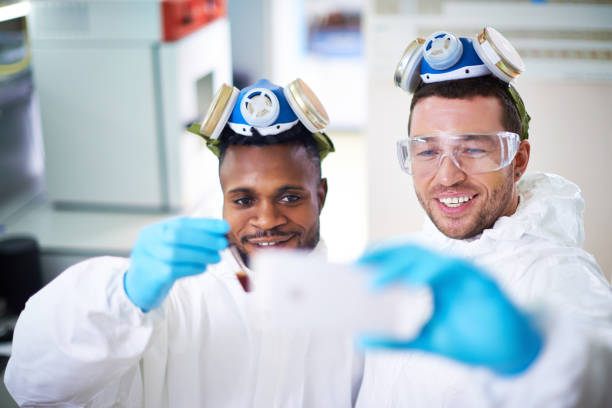 istock Happy team of researchers making selfie 836558650