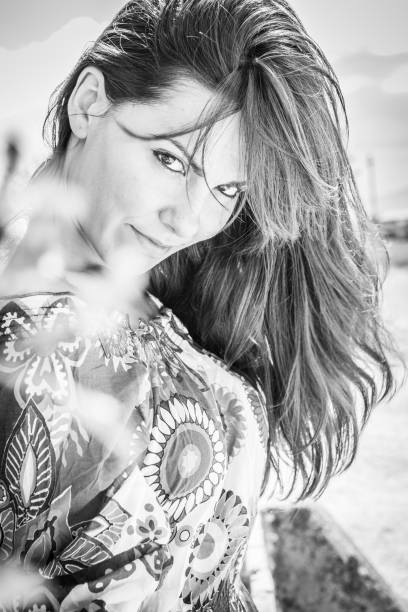 istock Beautiful young woman enjoy in flowering spring nature 836558794