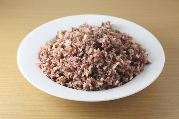istock Cooked brown thai rice berry or brown jasmine rice in white dish. 836559208