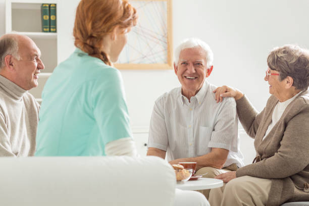 istock Seniors sitting with nurse 836559246