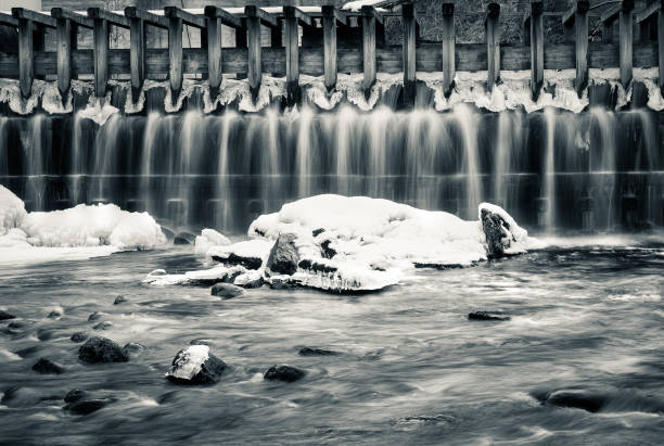 istock Little waterfall at winter black and white style 836562608