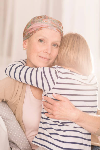 istock Mother with leukemia hugging child 836562704