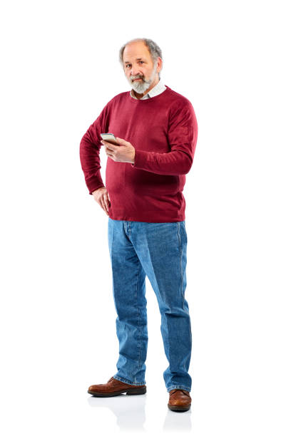 istock Senior man holding smart phone and looking at camera white 836562862
