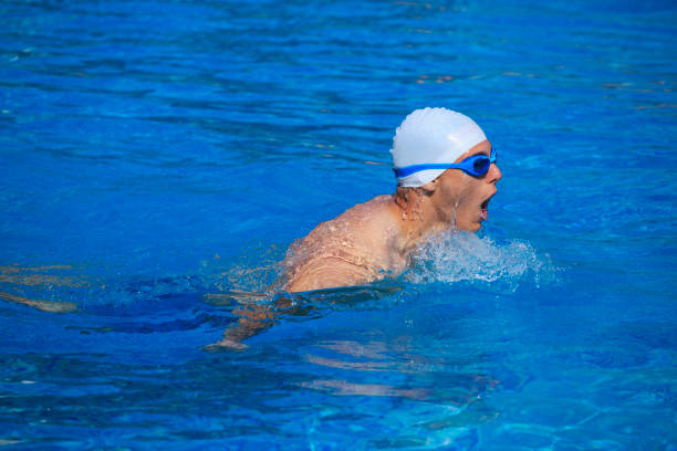 istock Young swimming in the pool with equipment 836563720