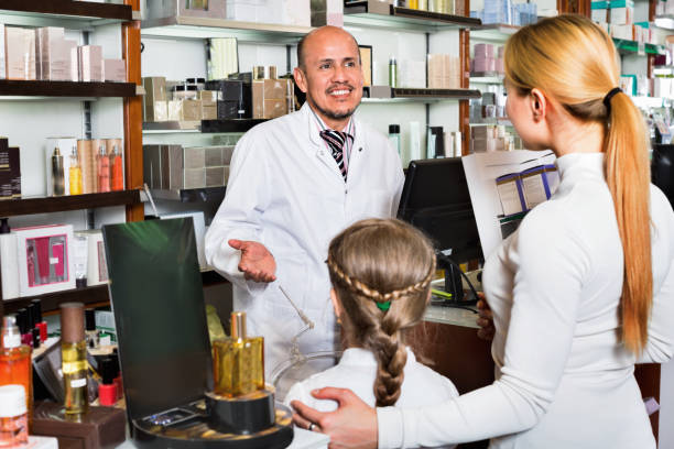istock Male pharmacist working pharmaceutical store and consulting customers 836564062