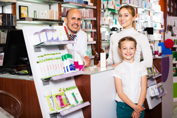 istock Smiling girl in a pharmacy 836564064