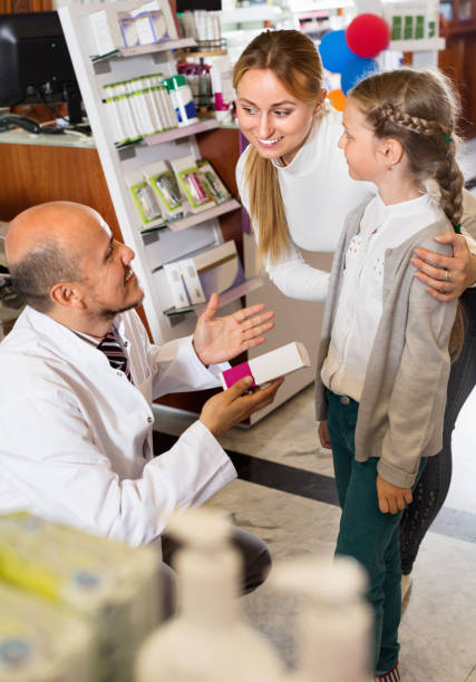 istock Male pharmacist working pharmaceutical store and consulting customers 836564340