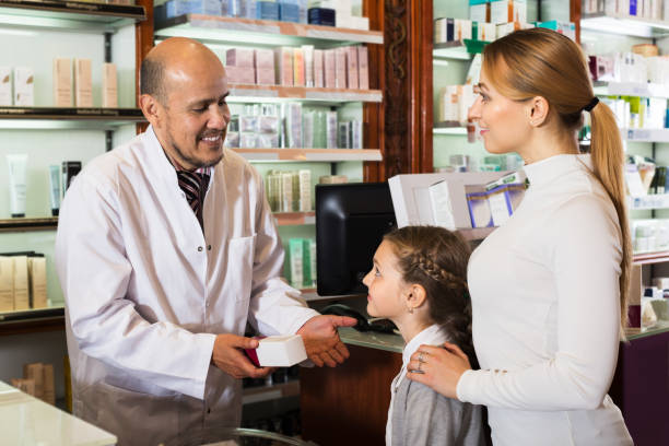 istock Mature pharmacist consulting customers 836564356