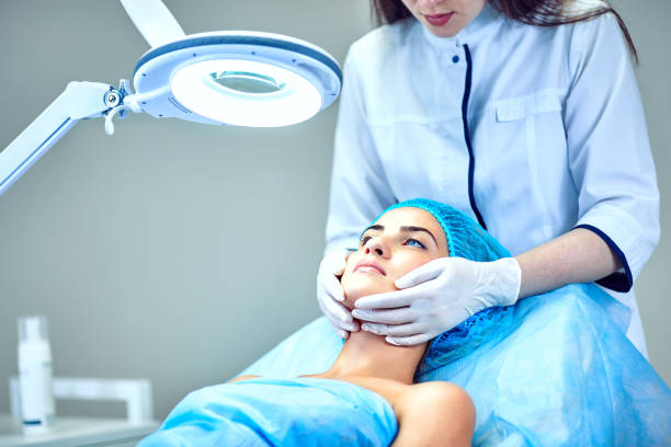 istock The cosmetologist is caring for the patient's face 836564438