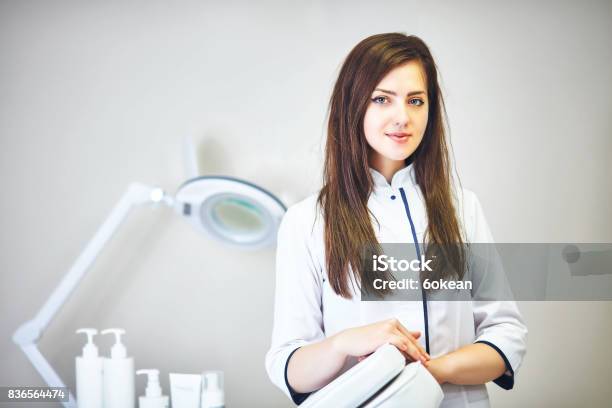 The Cosmetologist Is Caring For The Patients Face Stock Photo - Download Image Now - Beautician, Student, Computer