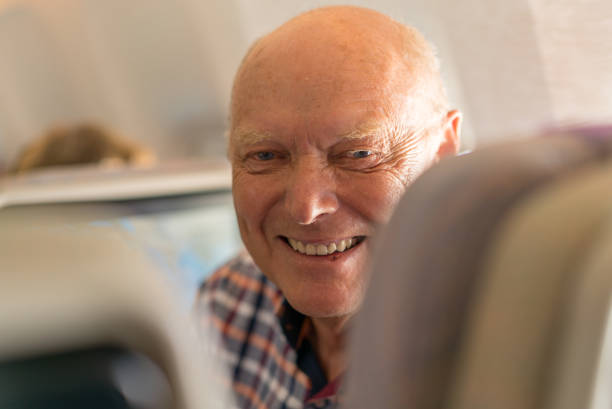istock Airport, happy smiling senior passenger 836566956