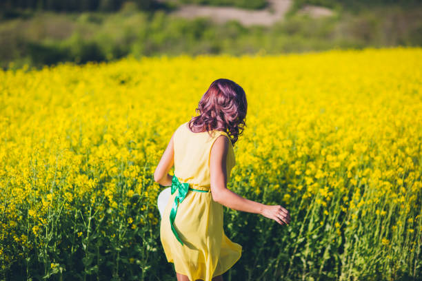 istock Redhead girl make fun at rapeseed meadow 836568404