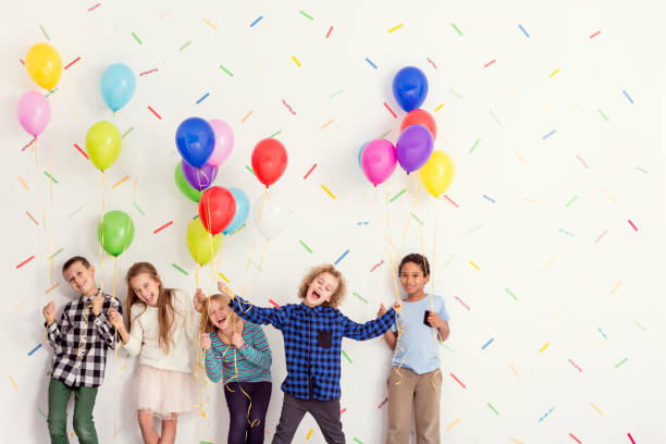 istock Happy kids with balloons 836578404