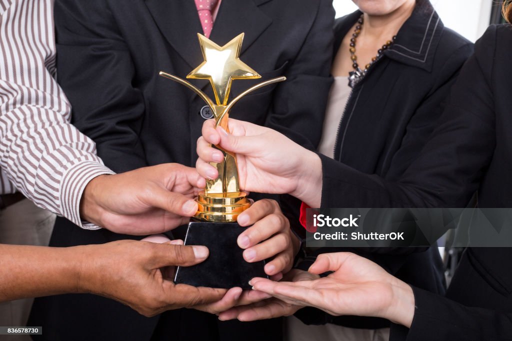 Award trophy winner business team Award trophy winner business team with their success. Award Stock Photo