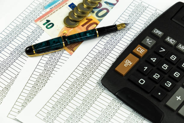 istock Finance, euro coin, pen, and pocket calculator on white background 836594122