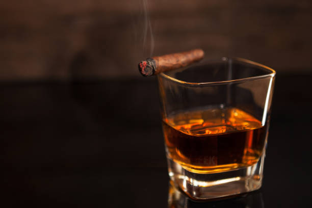 istock Smoking cigar and glass of whiskey 836595022